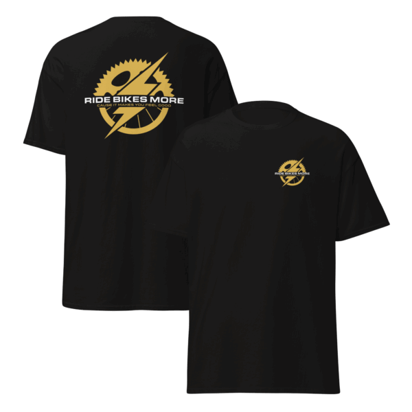 Black t-shirt with gold lightning logo and white "Ride Bikes More" text — Drop 002: The Slipstream Set